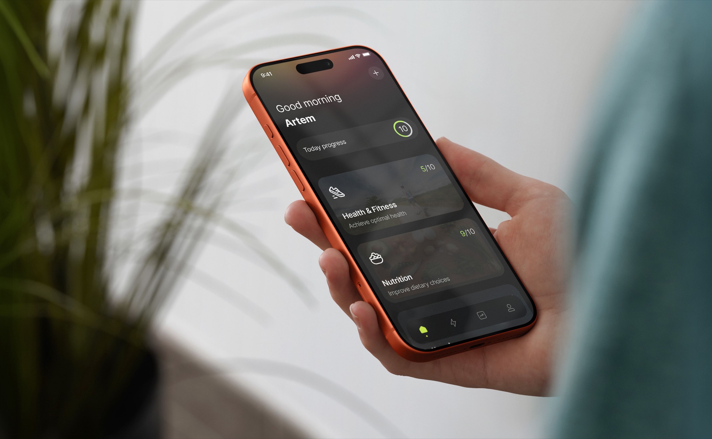Eine Hand hält ein Telefon, das den Tagesfortschritt-Bildschirm der Motiway-App zeigt